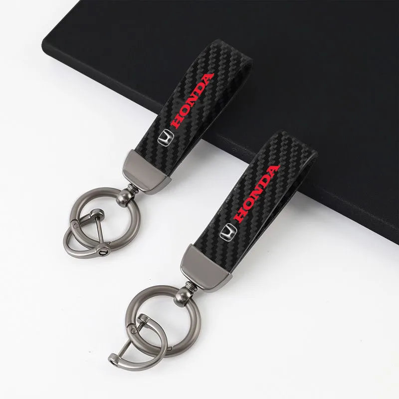 chaveiro automotivo em fibra de carbono e couro para honda com acabamento premium e sistema anti perda